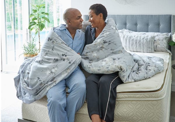 Halcyon Elysium organic mattress couple on bed