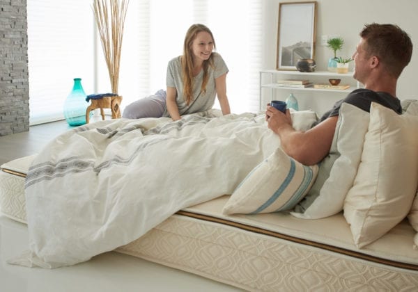 naturepedic-Halcyon-Azure-organic-mattress with couple on bed
